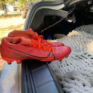 Soccer cleats in good condition (red/orange) for sale